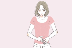 生理前にお腹が張る女性